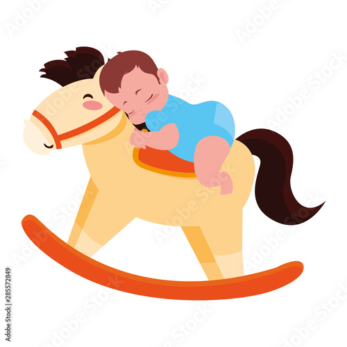 baby boy with toy rocking horse