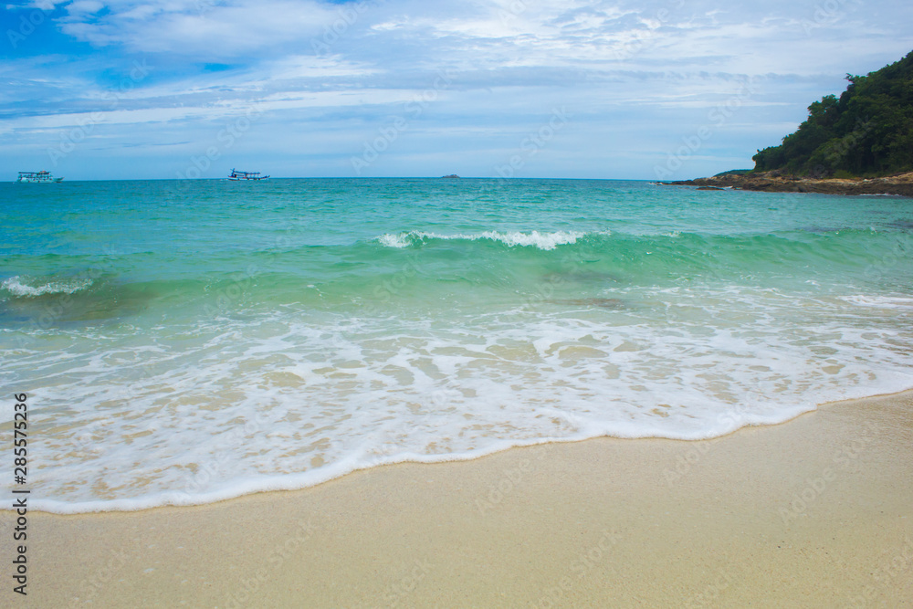 Soft Wave Of Blue Ocean On Sandy Beach