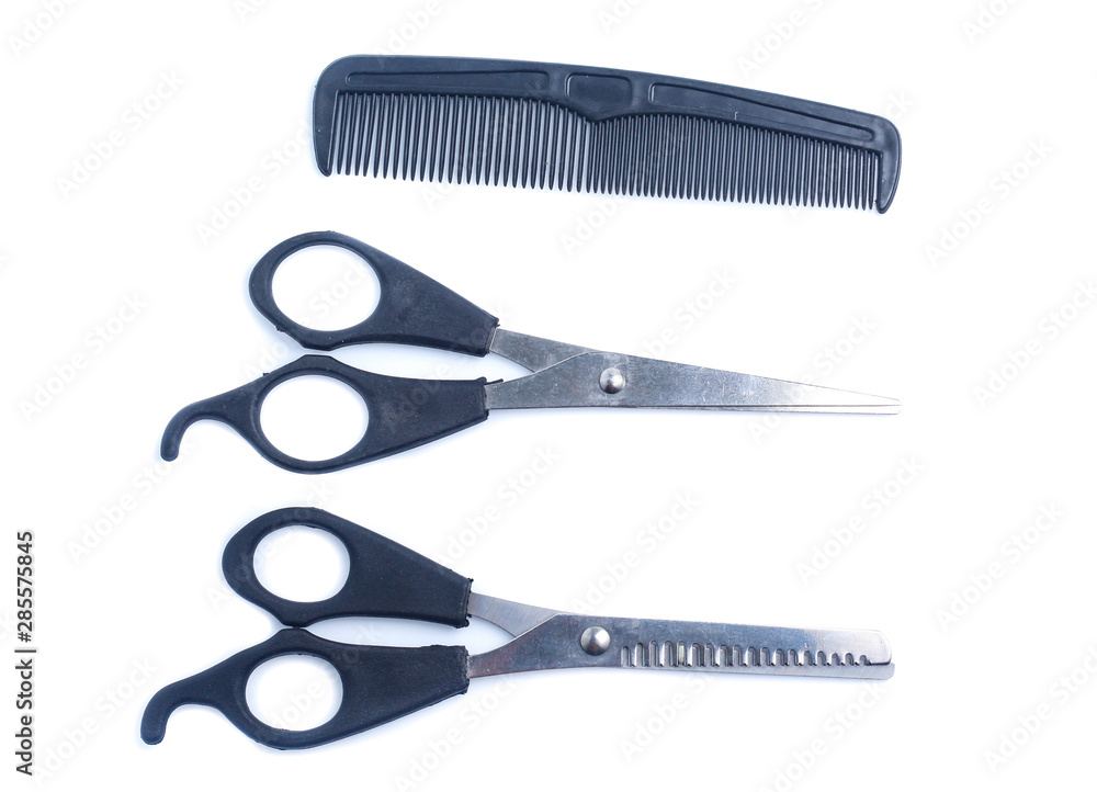 Comb with scissors on a white background Comb with scissors on a white background