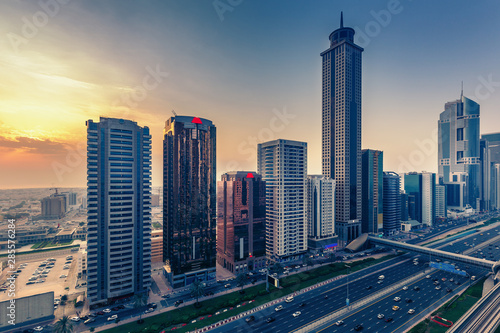 Downtown Dubai at sunset. Scenic view on highways and skyscrapers.