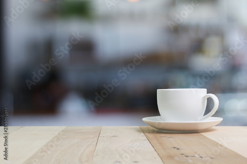 Hot Coffee cup on the wooden table