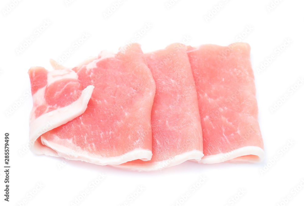 Raw pork meat with parsley herb leaves isolated on white background Raw pork meat with parsley herb leaves isolated on white background