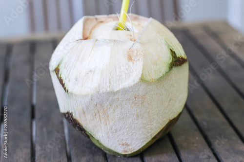 fresh coconut drink with a straw