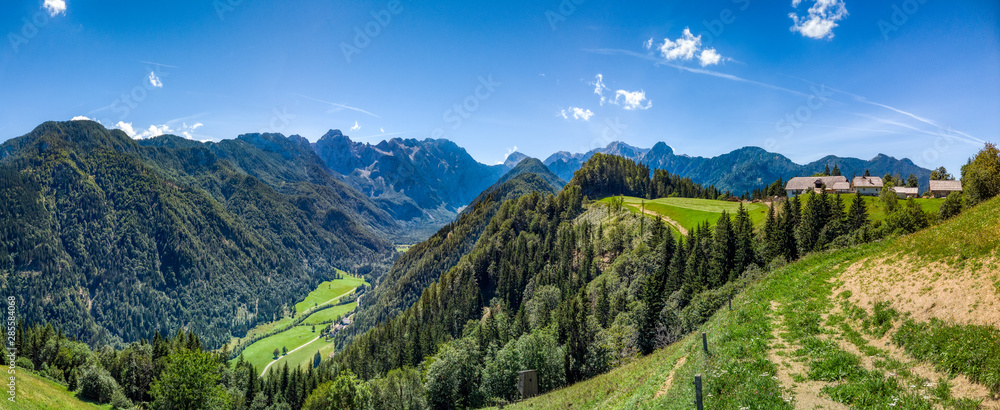 Farm above Logar valley, Alps in Slovenia with farm and meadows