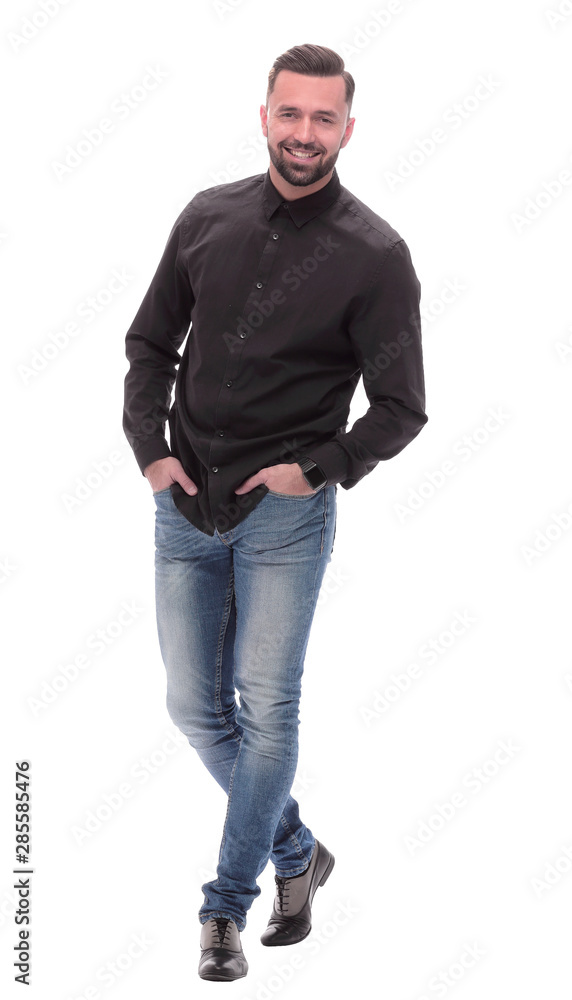 in full growth. successful young man in jeans in full growth. successful young man in jeans