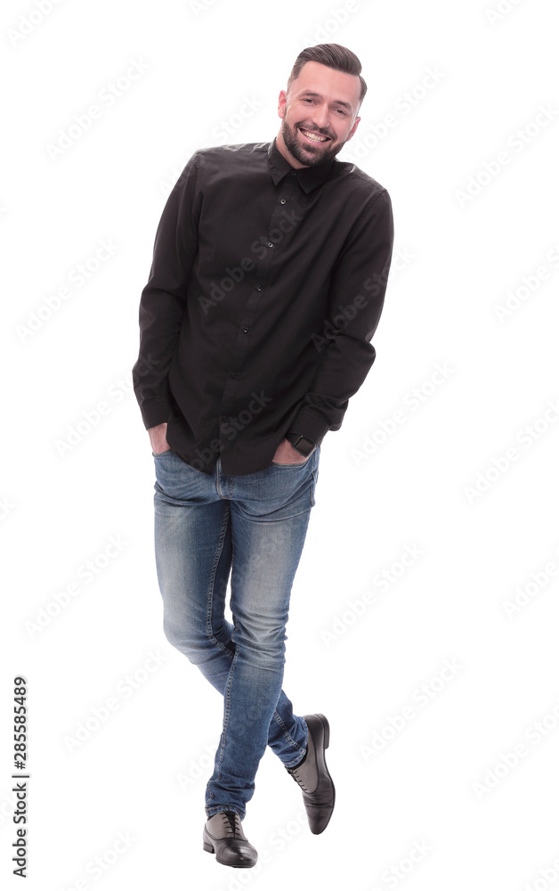 in full growth. successful young man in jeans in full growth. successful young man in jeans