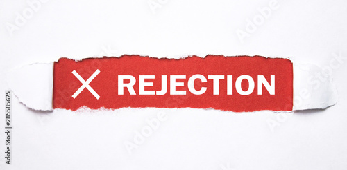 Rejection word on torn paper.