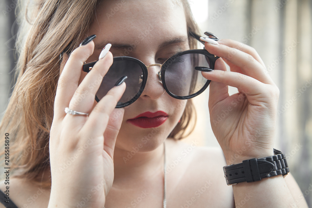 Portrait of young woman with sunglasses. Portrait of young woman with sunglasses.