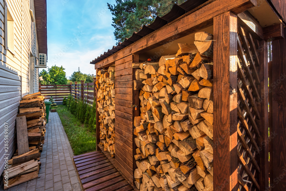 harvesting firewood for the winter near wooden village vacation home harvesting firewood for the winter near wooden village vacation home