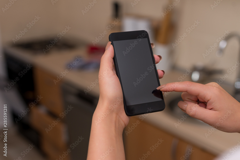 woman using smartphone office supplies technological devices inside home