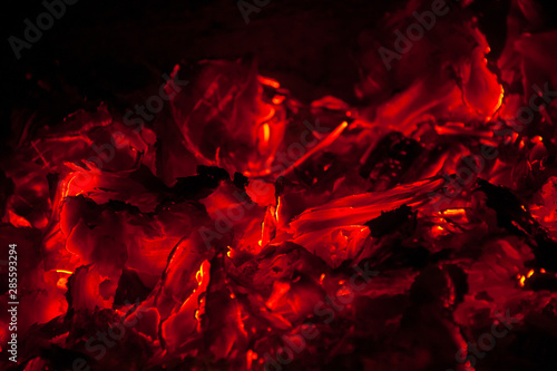 Nature fire flames on black background. Fire burning firewood burning fire flame texture in the fireplace charcoal. Concepts: fire, BBQ. barbeque, still life