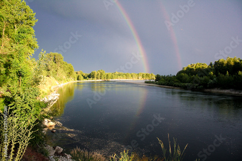 Double rainbow reflected on Ticino river. Cuggiono, Lombardia, Italy.