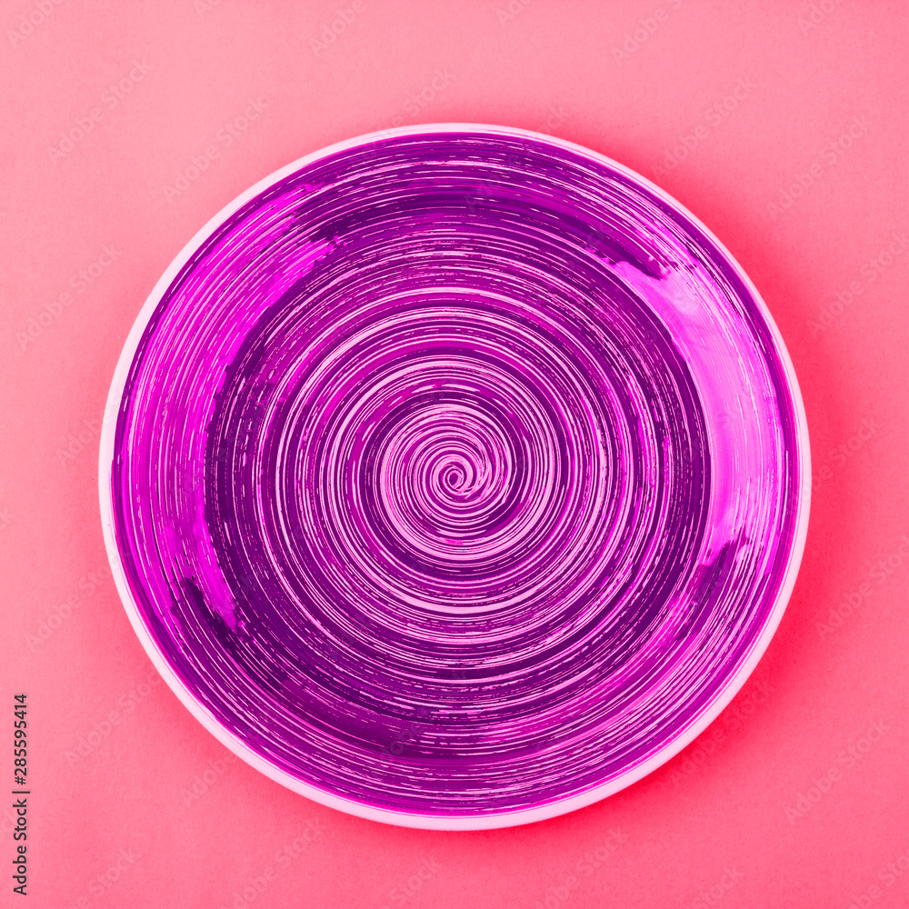 Saturated pink plate on the light red background Saturated pink plate on the light red background