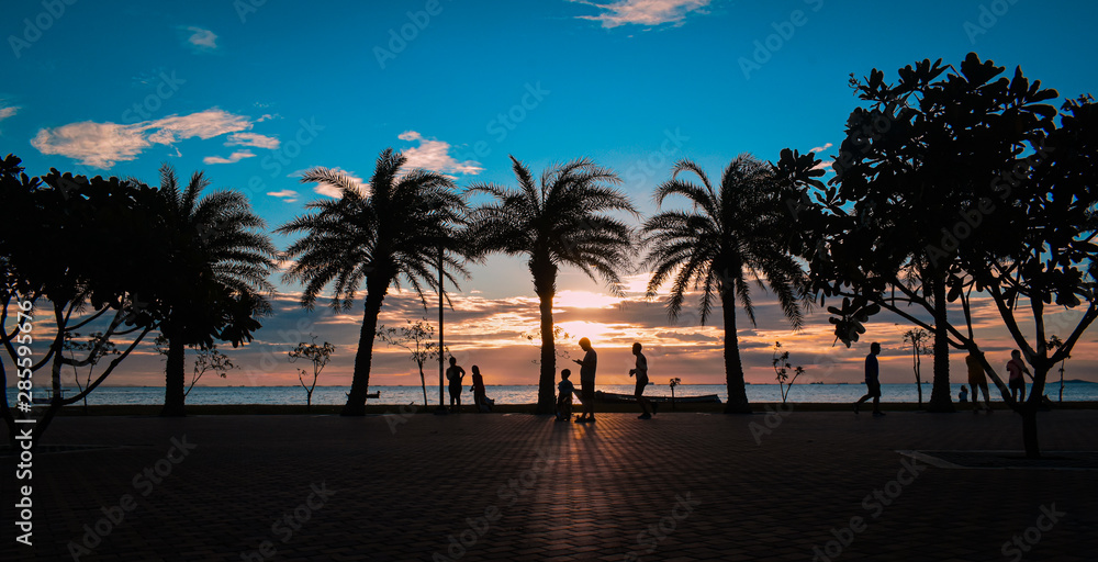 Relax on the beach, people strolling, enjoying the beautiful sunset. Relax on the beach, people strolling, enjoying the beautiful sunset.