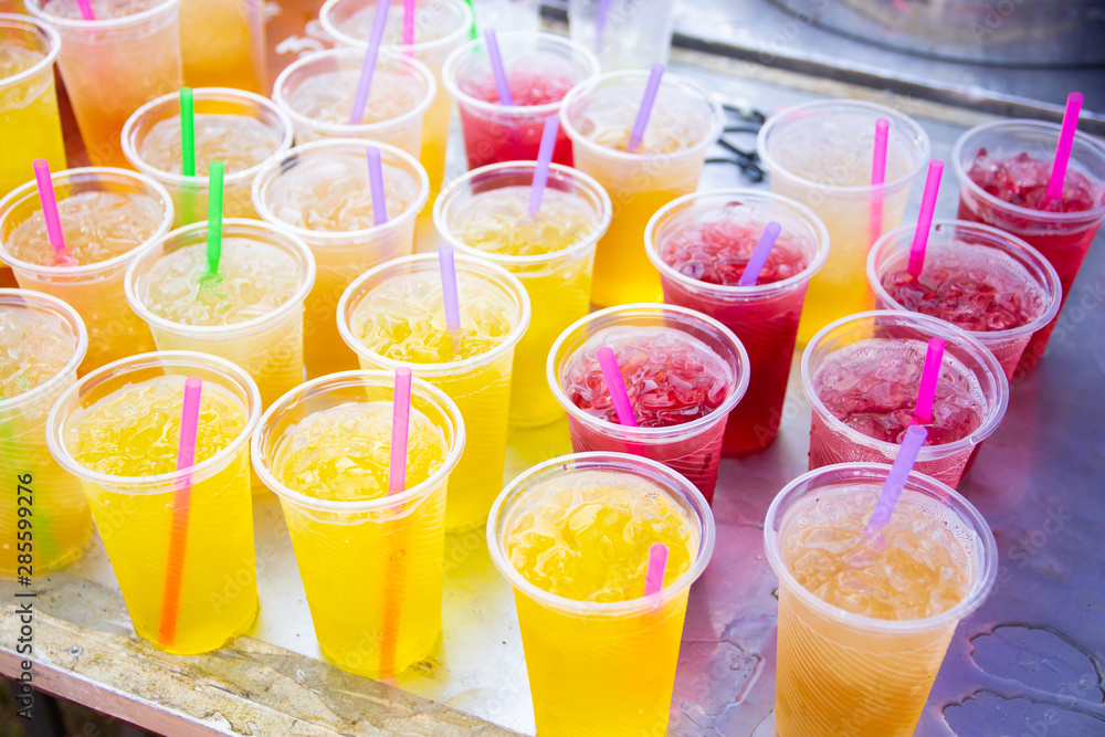 Colorful soft drink in plastic cup