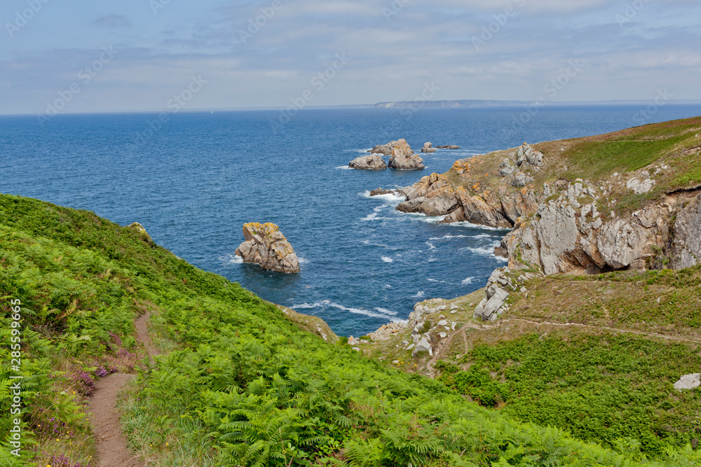 a costal path with lush green  on the Atlantic coast of Brittany called Pointe du Raz