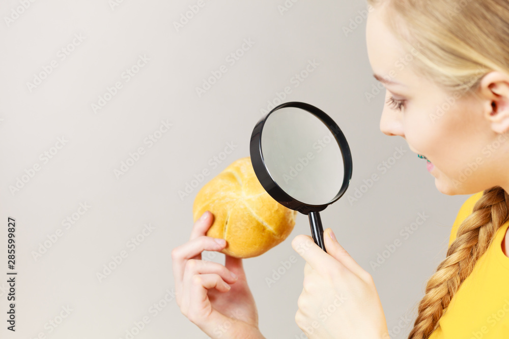 Bun bread roll and magnifying glass Bun bread roll and magnifying glass