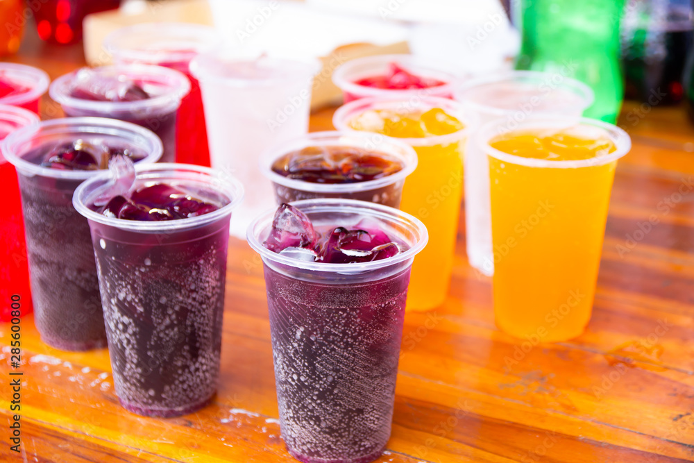 Colorful soft drink in plastic cup Colorful soft drink in plastic cup