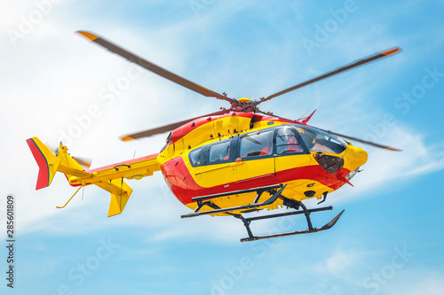 Red and yellow Helicopter of air rescue service Team.
