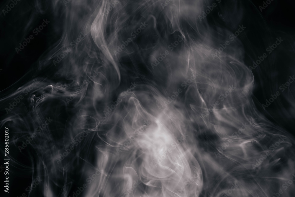 Obraz premium Brown wavy smoke on black background