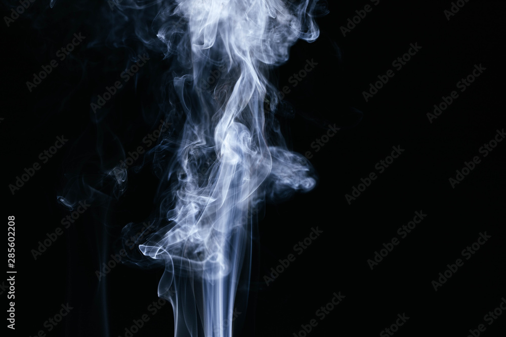 White wavy smoke on black background White wavy smoke on black background
