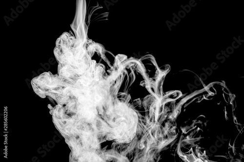 White wavy smoke on black background