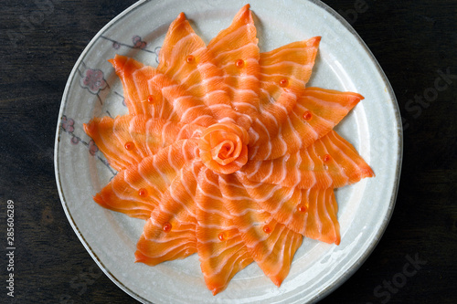 Slices of raw Salmon sashimi on dish
