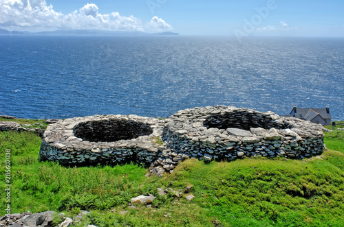 Beehive Huts  situated on the Dingle Peninsula in County Kerry in the south-west of Ireland. photo