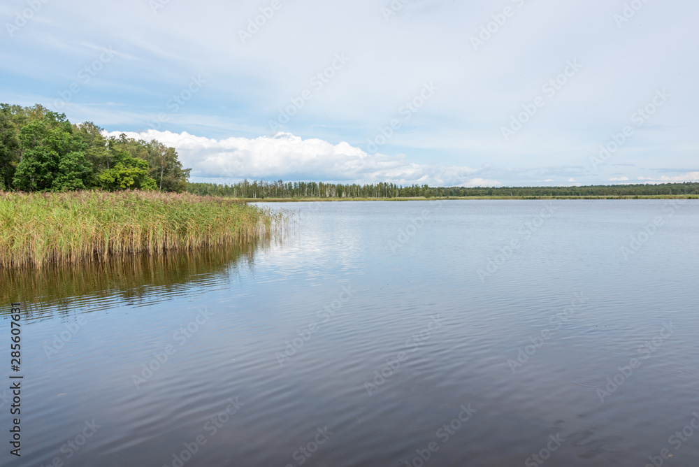 Long Exposure of a Lake in Latvia on a Cloudy Day Long Exposure of a Lake in Latvia on a Cloudy Day
