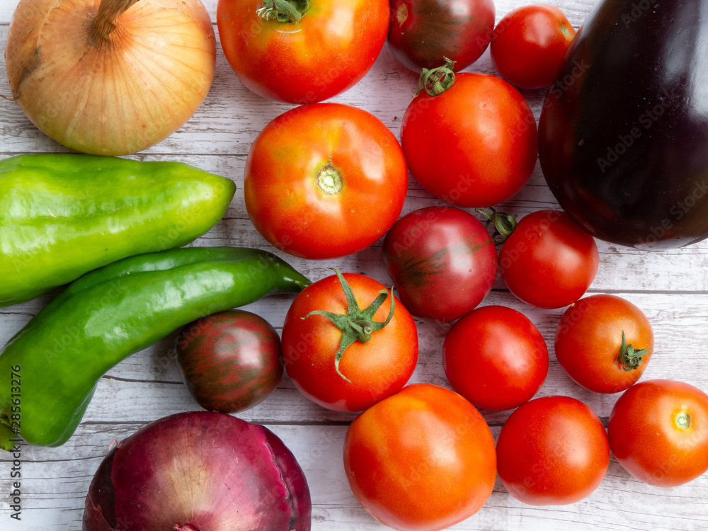 Variety of fresh vegetables on wooden surface Variety of fresh vegetables on wooden surface