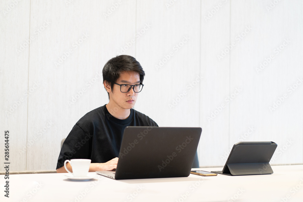 A man is working and talking with computer. A man is working and talking with computer.