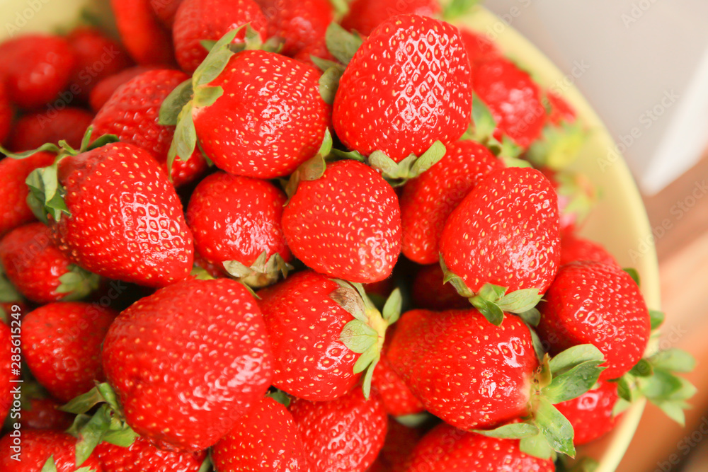 background from freshly harvested red strawberries background from freshly harvested red strawberries
