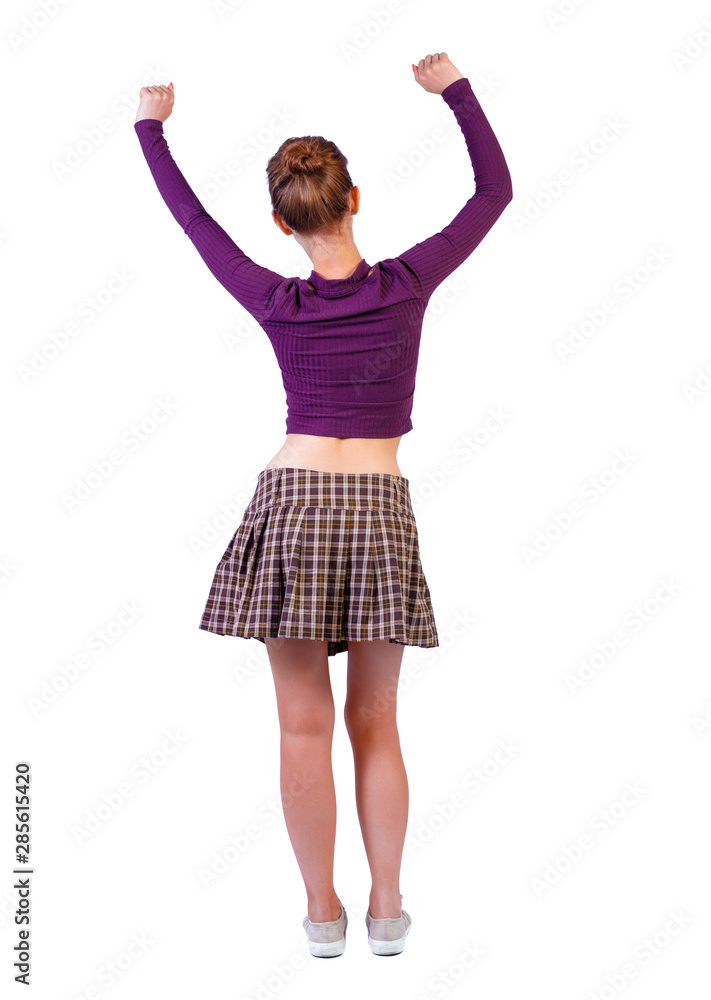 back view of dancing young beautiful woman. back view of dancing young beautiful woman.