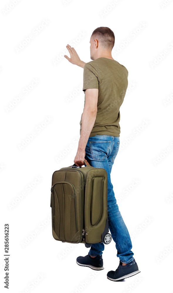 back view of walking man with suitcase greeting. back view of walking man with suitcase greeting.