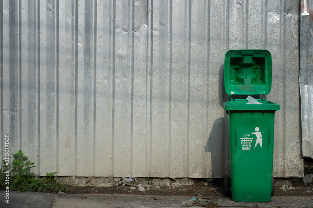 Green trash can with copy space Green trash can with copy space