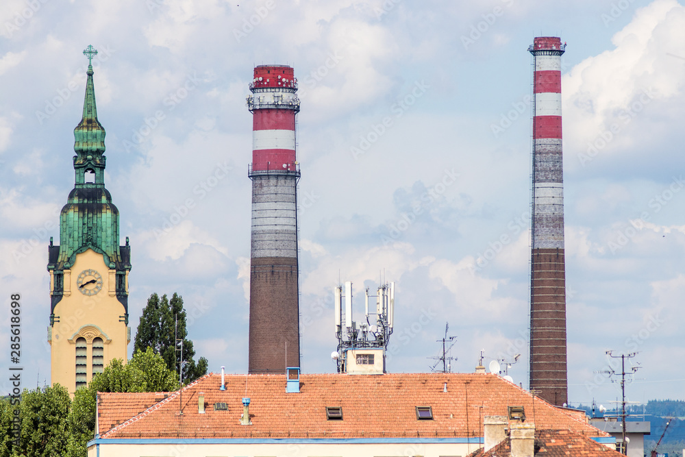 Chimneys and church tower in Brno, Czech republic