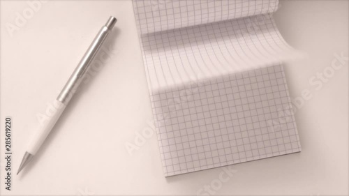 notebook and pen on white background