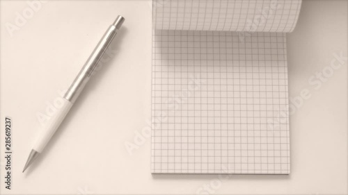notebook and pen on white background