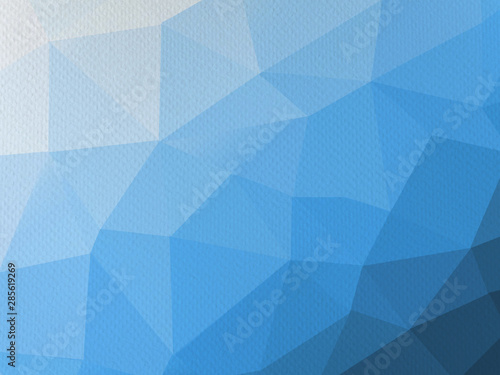 Blue polygonal graphic on paper texture 