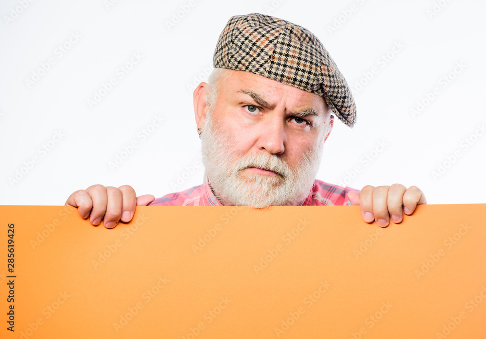 Announcement concept. Pensioner hold poster information copy space. Senior bearded man peeking out of banner place information. Timing and schedule. Public information. Advertisement elderly people Announcement concept. Pensioner hold poster information copy space. Senior bearded man peeking out of banner place information. Timing and schedule. Public information. Advertisement elderly people