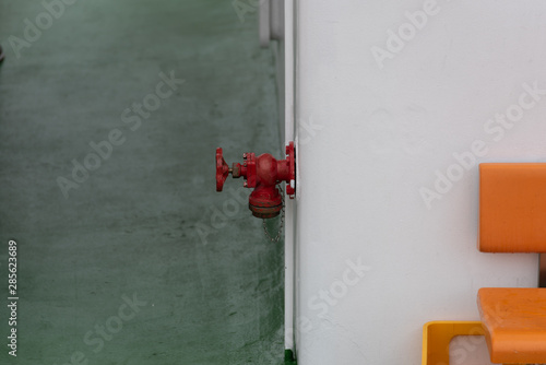 red hydrant on a ferry