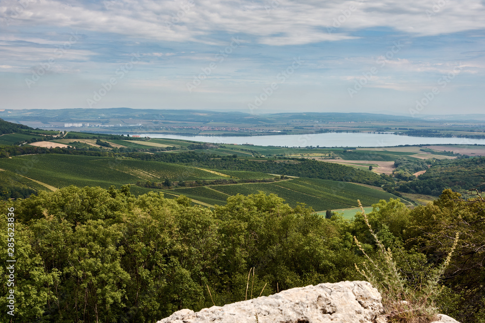 Landscape view of Palava in South Moravia. Lake Nove Mlyny and towns Pavlov and Klentnice under sky with clouds Landscape view of Palava in South Moravia. Lake Nove Mlyny and towns Pavlov and Klentnice under sky with clouds