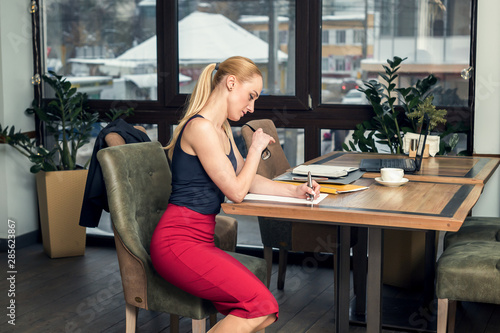 Business woman working with documents at office.