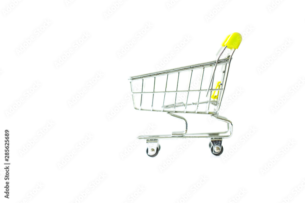 Miniature shopping cart isolated on white background.
