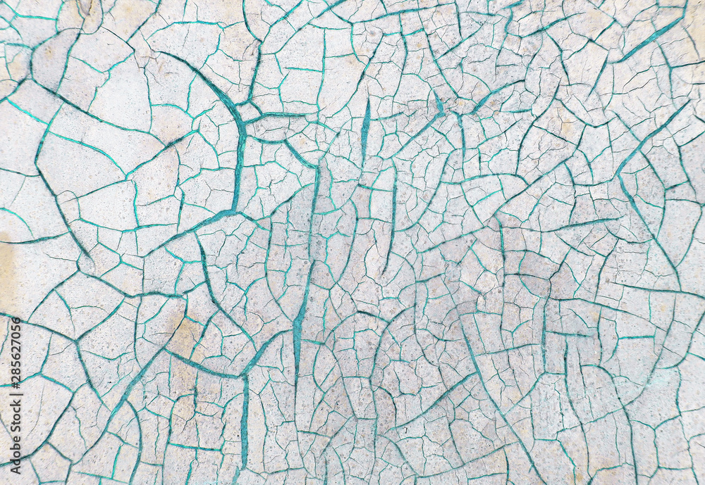 Cracked paint on wooden background, texture. Vintage wallpaper
