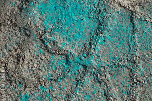 Turquoise holi color powder on ground