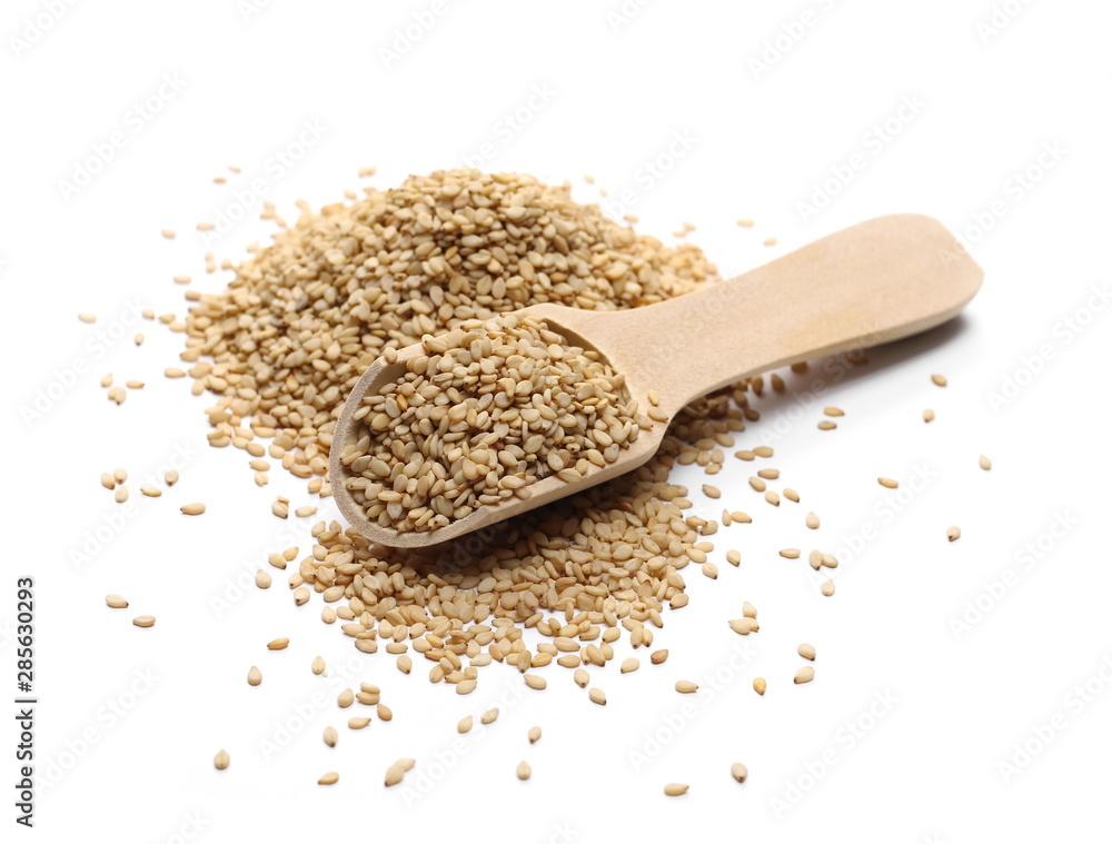 Organic integral sesame seeds with wooden spoon isolated on white background Organic integral sesame seeds with wooden spoon isolated on white background