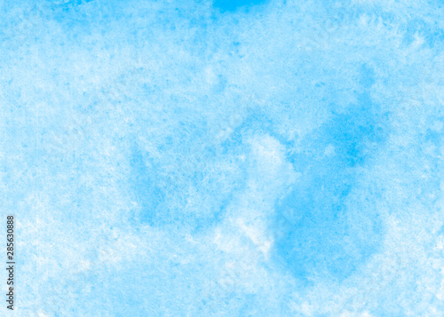 Blue abstract watercolor background. Blue sky background. The texture of the paper. Hand-drawn.