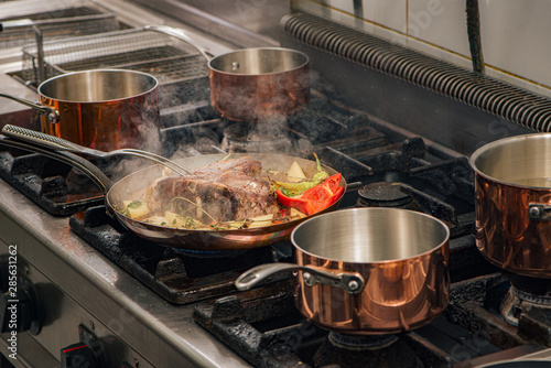 Preparation of delicious food on the stove at the restaurant.