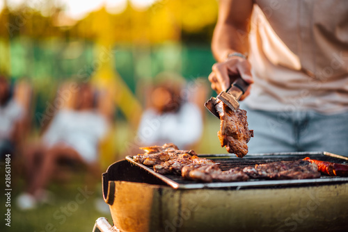 Obraz na płótnie Making barbecue outdoors, close-up, copy space.